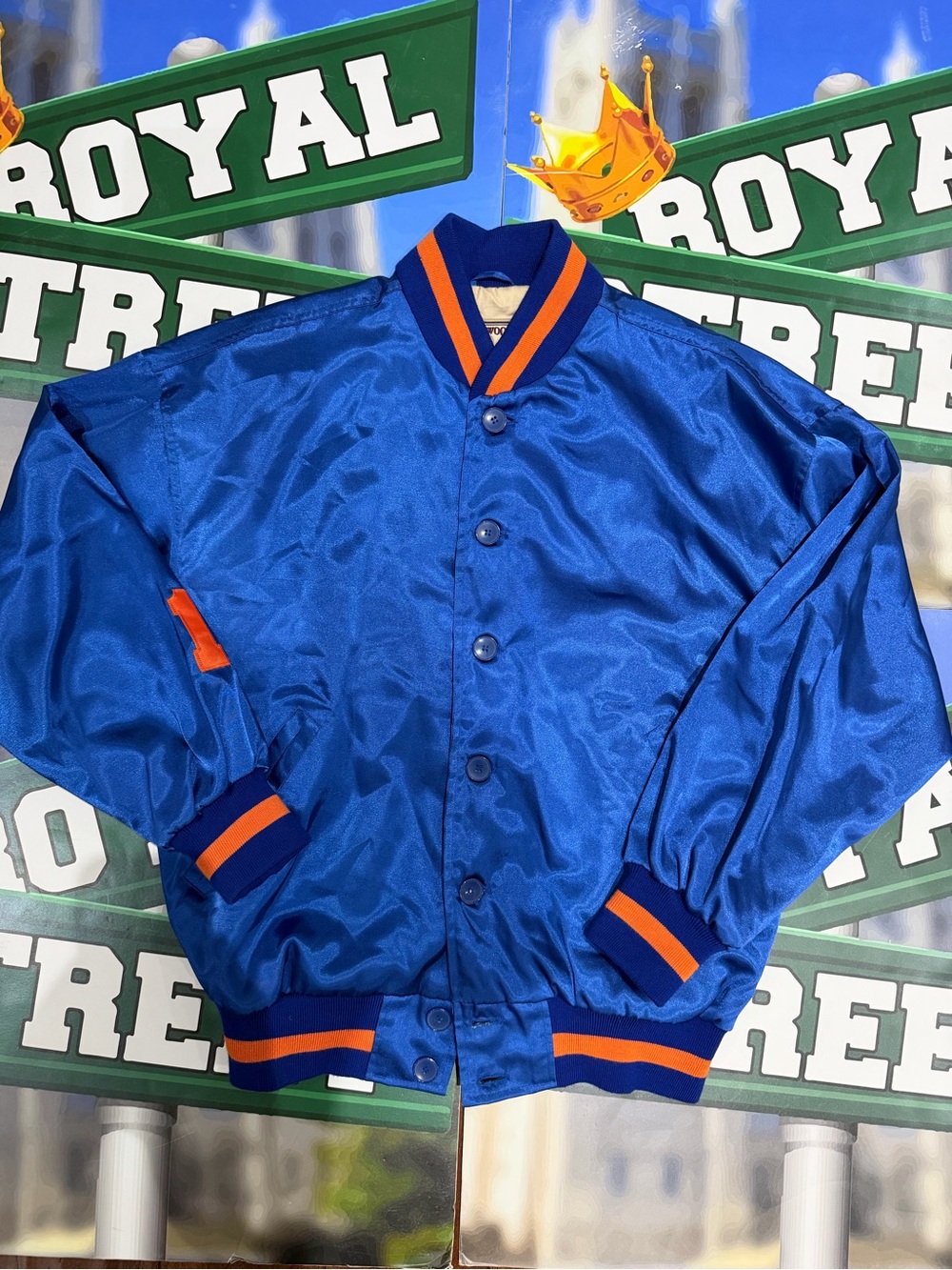 Mitchell & Ness New York Knicks Blue Satin Bomber Jacket with Orange Trim
